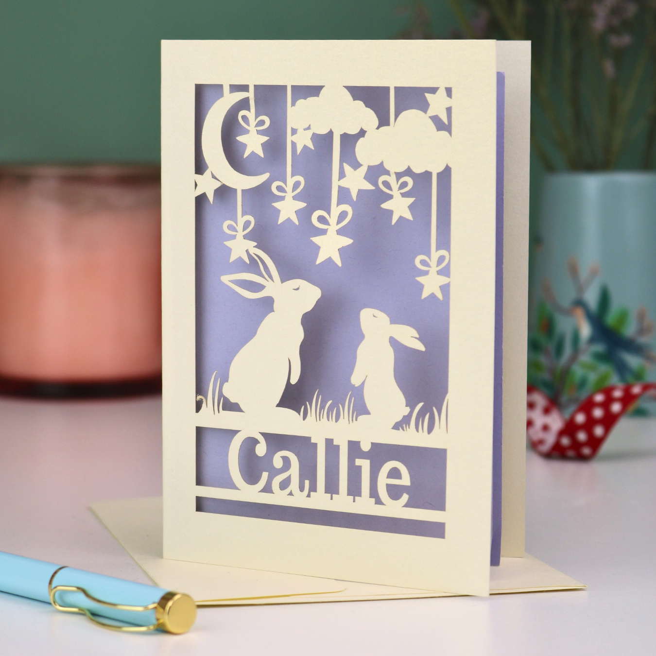 Special birthday Card with cut-out design of two rabbits and the name 'Callie' on a purple background.