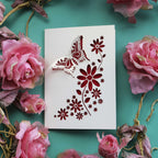 A butterfly card with push of 3D effect wings and flower details