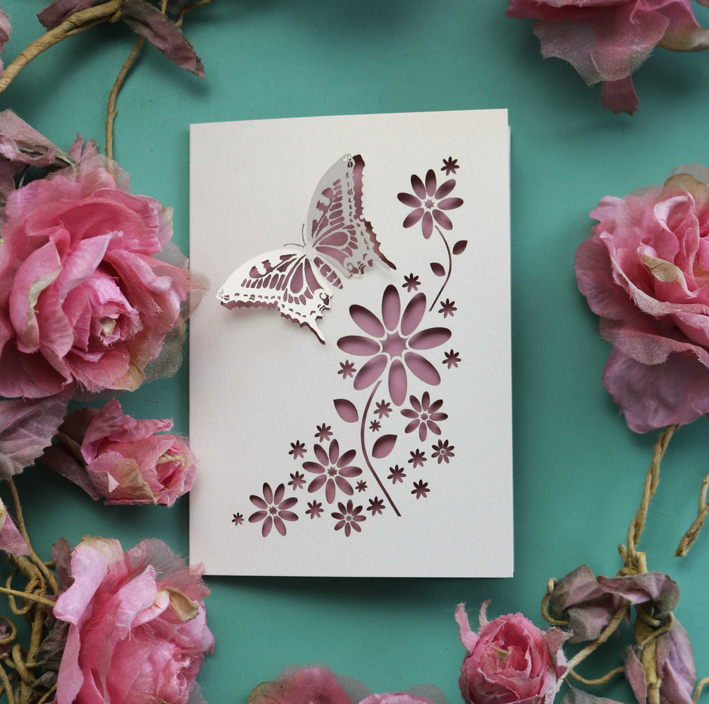 An any-occasion greeting card with 3D butterfly and cut out flowers