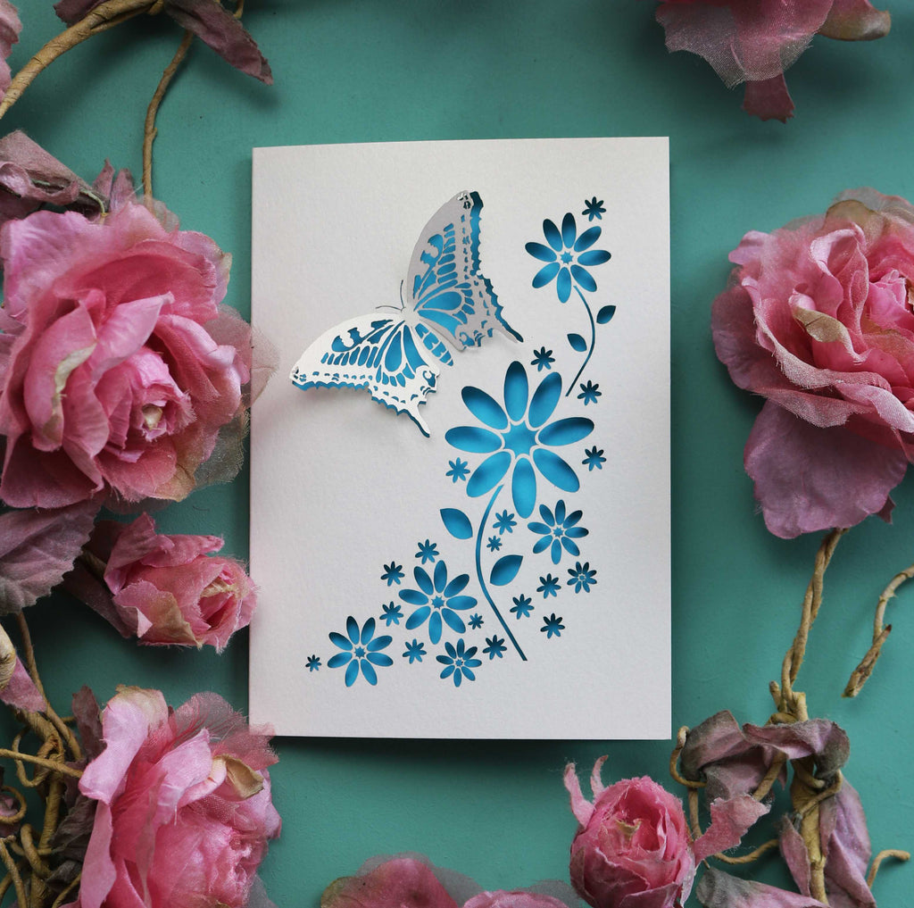 A laser cut butterfly and flowers card