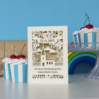 A cream and gold leaf Christening card personalised with the date and child's name