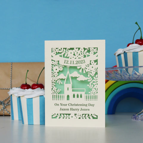 A cream and light green Christening card that has date and name personalisation.  - A6 (small) / Light Green