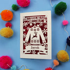 Unique Christmas card with festive Christmas jumper design on a blue background with colourful pom-poms.