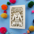 Unique Christmas card with festive Christmas jumper design on a blue background with colourful pom-poms.