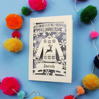 Unique Christmas card with festive Christmas jumper design on a blue background with colourful pom-poms.
