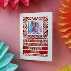 A paper cut Christmas card with a photograph
