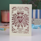 Personalised paper cut civil partnership card with decorative text and design on a blurred background