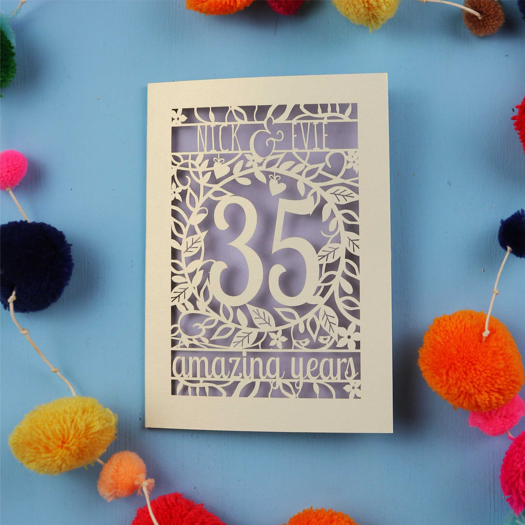 Keepsake Coral wedding anniversary Card with '35 amazing years' on a blue background with colourful pom-poms
