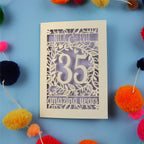 Keepsake Coral wedding anniversary Card with '35 amazing years' on a blue background with colourful pom-poms