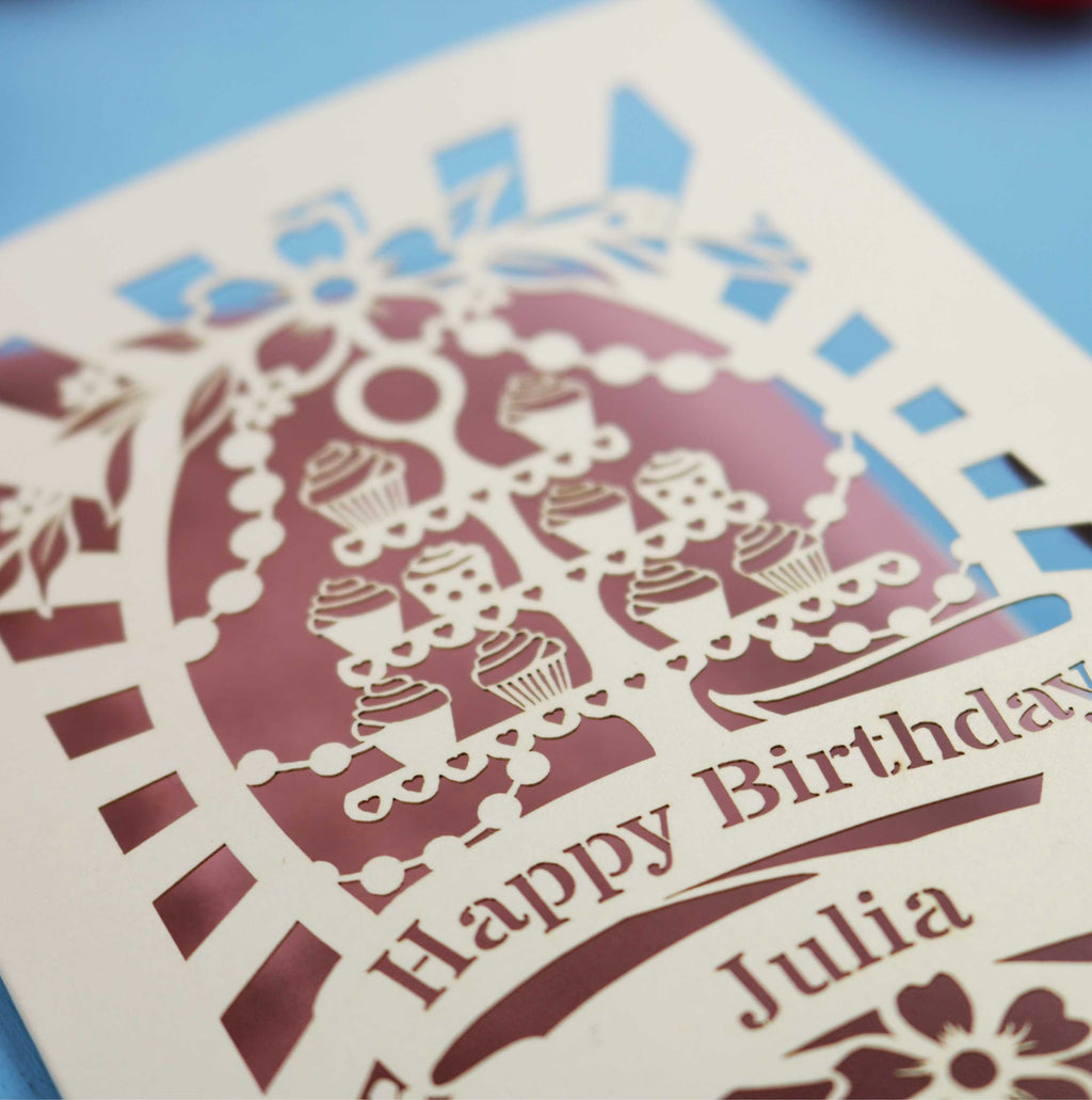 Laser-cut birthday card with decorative elements and 'Happy Birthday Julia' text on a blue background.
