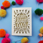 Dad Christmas card with 'Merry Christmas to my Dad' text on a blue background with colourful pom-poms.