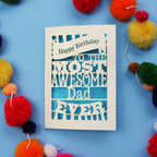Dad Birthday Card with 'Happy Birthday to the most awesome Dad ever' text on a blue background with colourful pom-poms.