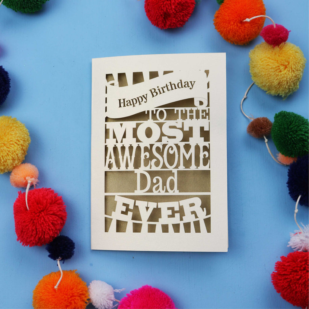 A Dad Birthday card for the most awesome dad ever with colourful pom-poms on a blue background