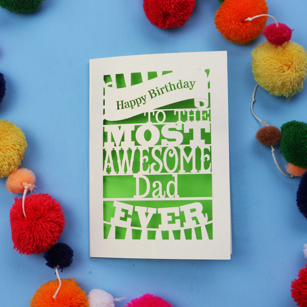 A Dad Birthday card for the most awesome dad ever with colourful pom-poms on a blue background