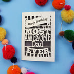 A Dad Birthday card for the most awesome dad ever with colourful pom-poms on a blue background