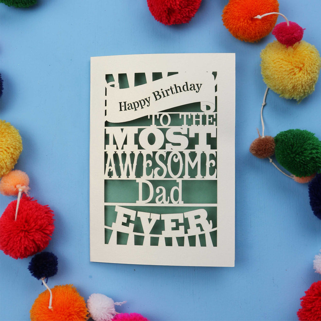A Dad Birthday card for the most awesome dad ever with colourful pom-poms on a blue background