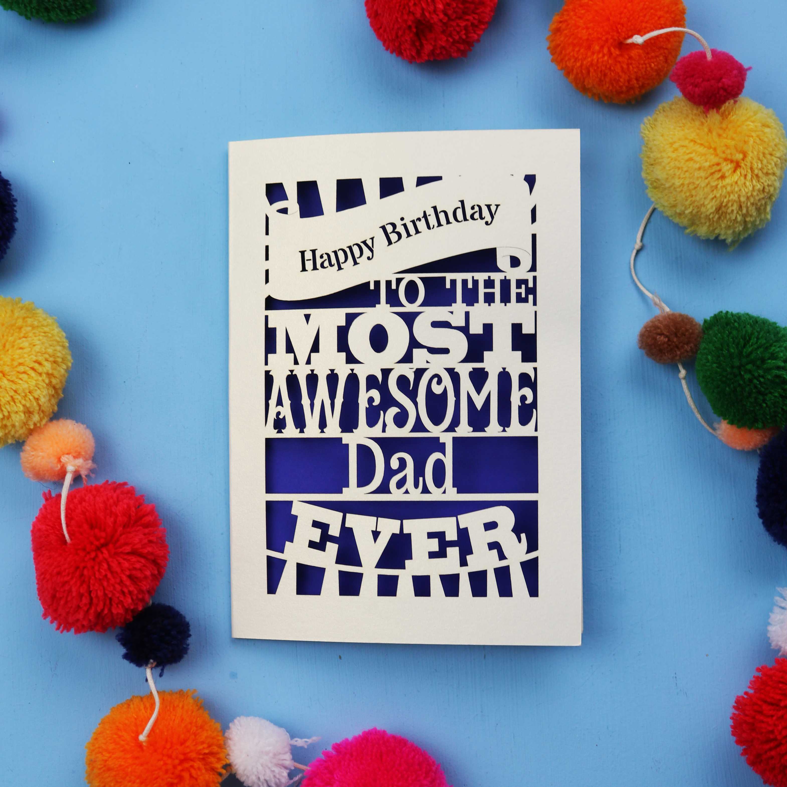 A Dad Birthday card for the most awesome dad ever with colourful pom-poms on a blue background