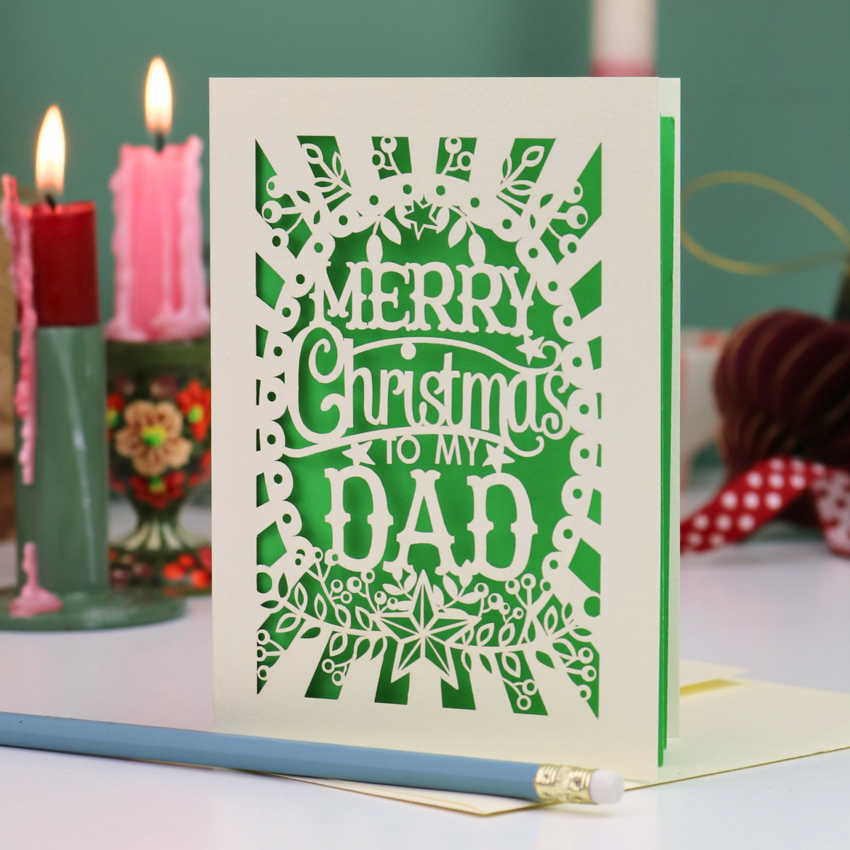 A laser cut Dad Christmas card with festive cut out text, 'Merry Christmas to my Dad'