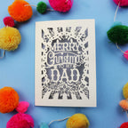 Dad Christmas card with 'Merry Christmas to my Dad' text on a blue background with colourful pom-poms.