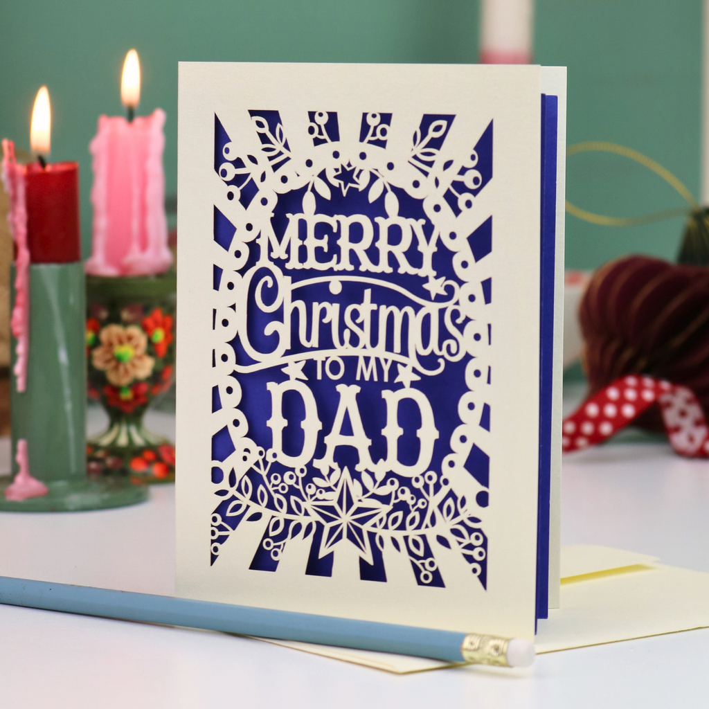 A laser cut Dad Christmas card with festive cut out text, 'Merry Christmas to my Dad'