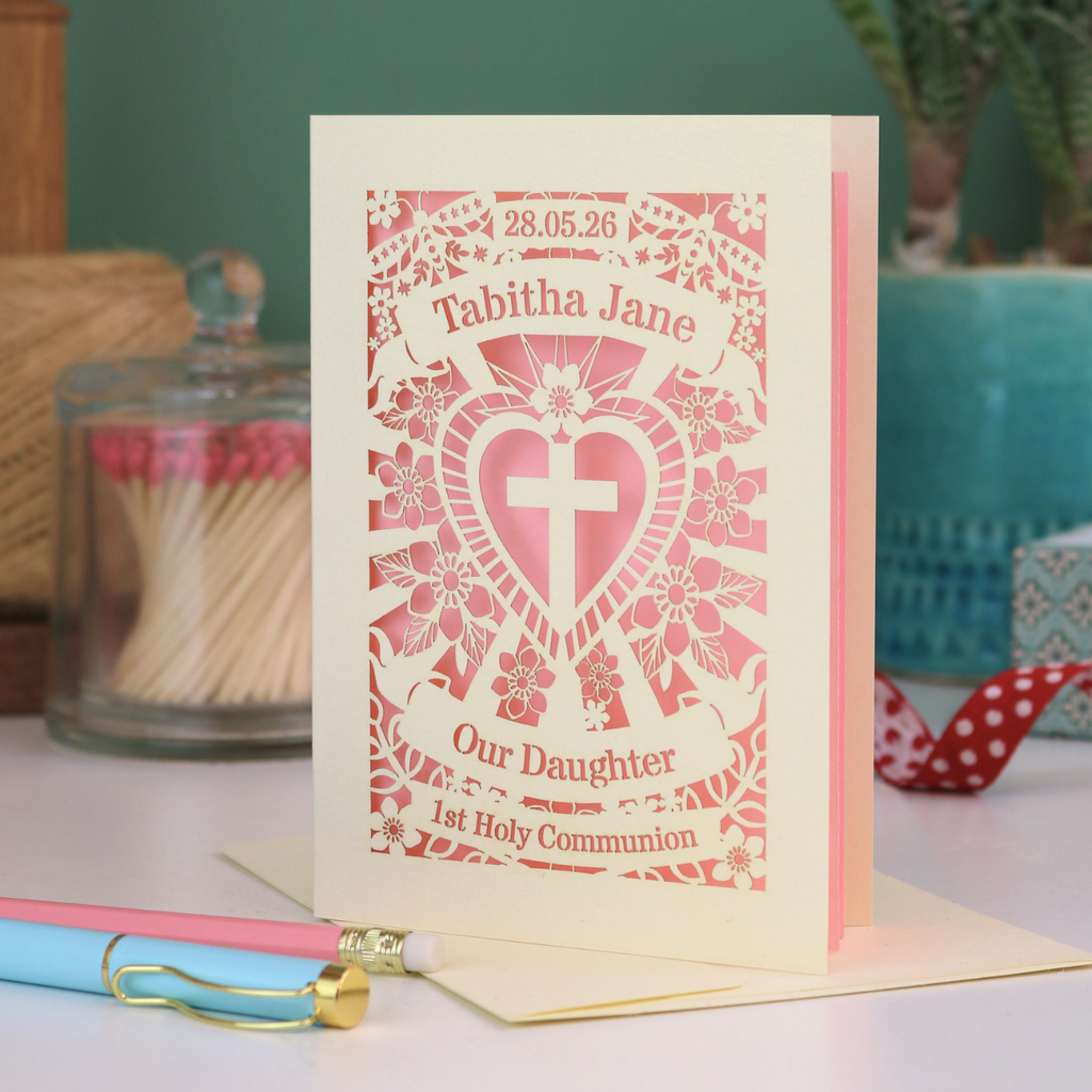 An intricate laser cut Daughter 1st Holy Communion card personalised with the date and name. 