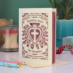 An intricate laser cut Daughter's 1st Holy Communion card personalised with the date and name. 