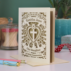 An intricate laser cut Daughter's first Holy Communion card personalised with the date and name. 