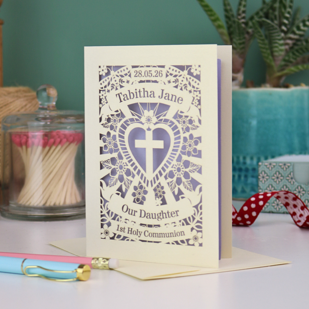An intricate laser cut Daughter's 1st Holy Communion card personalised with the date and name. 