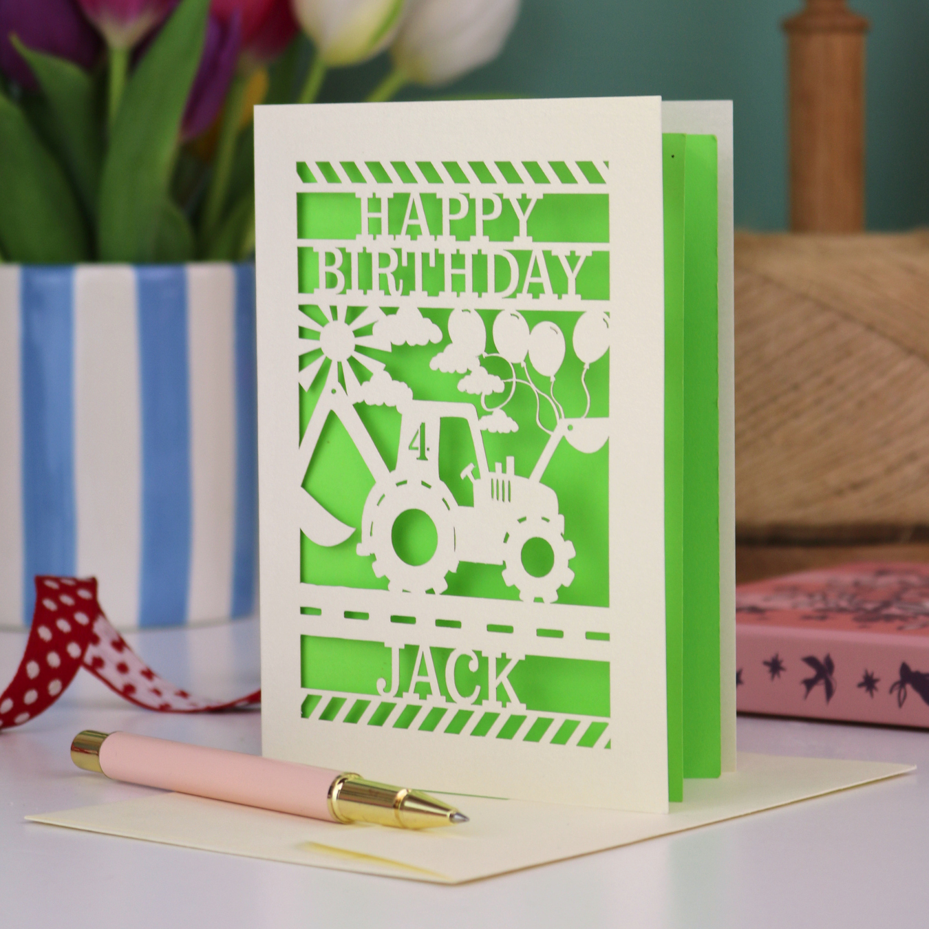 A grandson birthday card with laser cut digger design and "Happy Birthday" text, personalised with a name and age. 