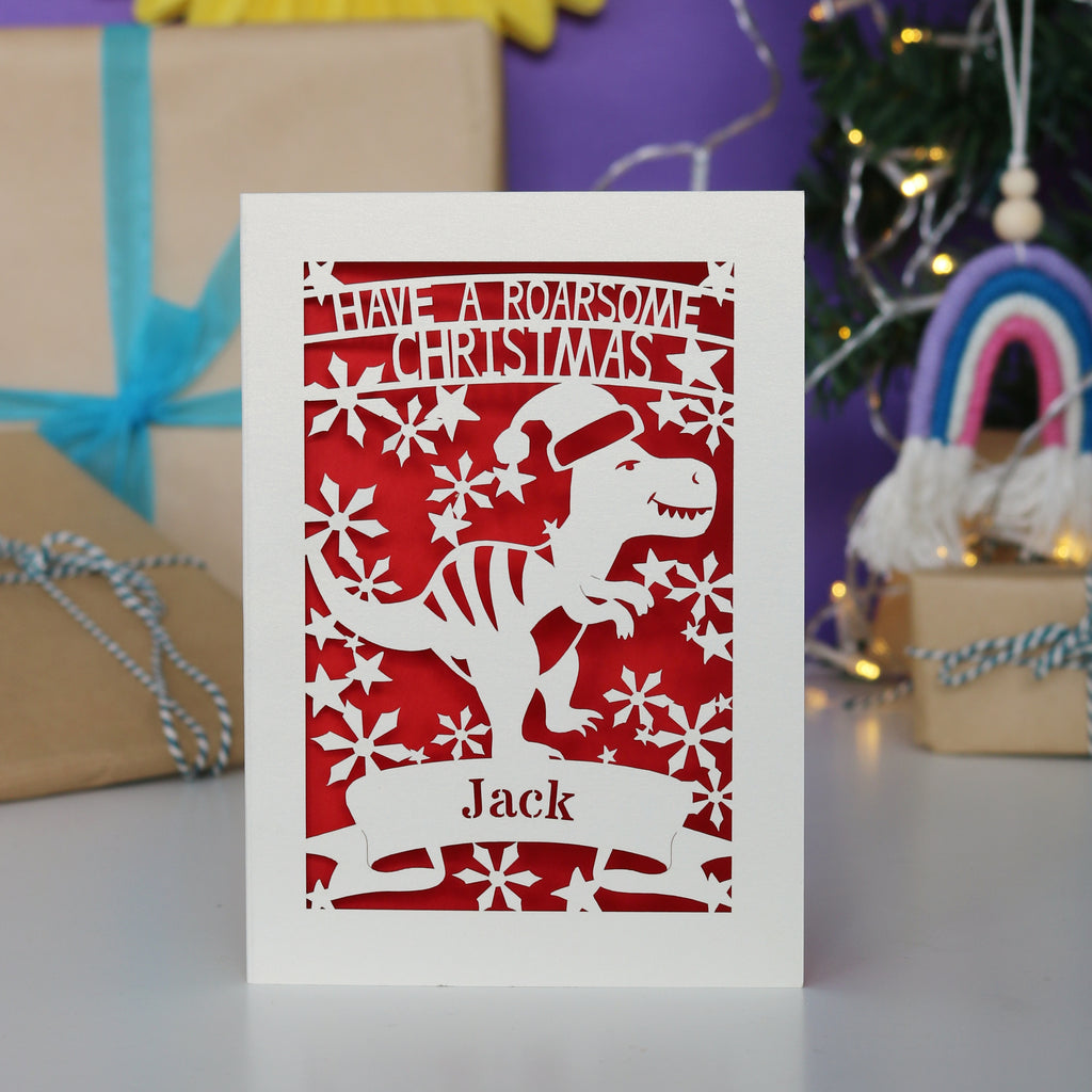 Laser cut Christmas card with dinosaur design