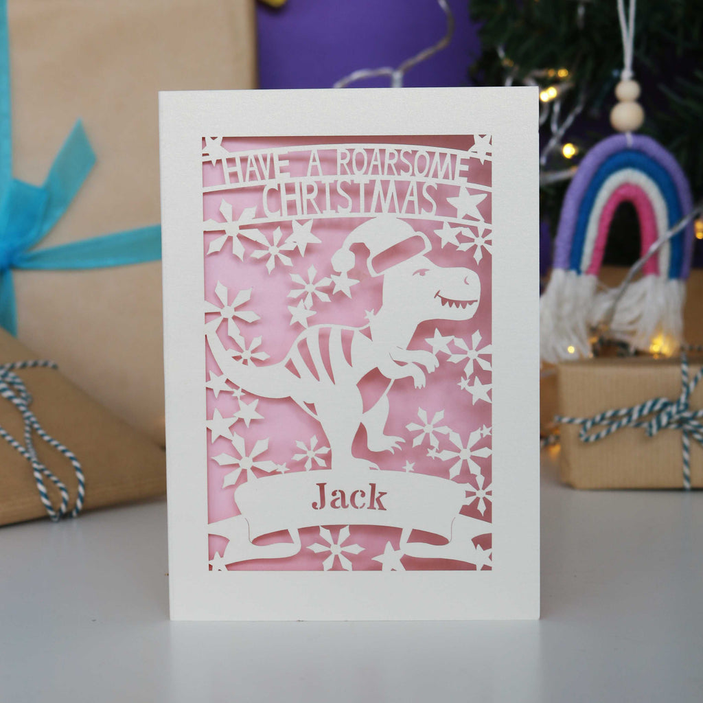 Laser cut Christmas card with dinosaur design