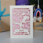 Laser cut Christmas card with dinosaur design
