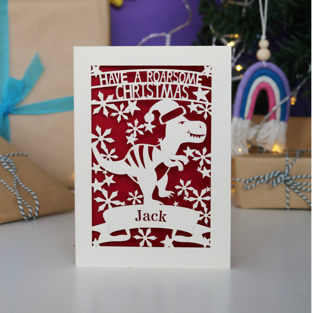 Laser cut Christmas card with dinosaur design