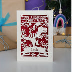 Laser cut Christmas card with dinosaur design