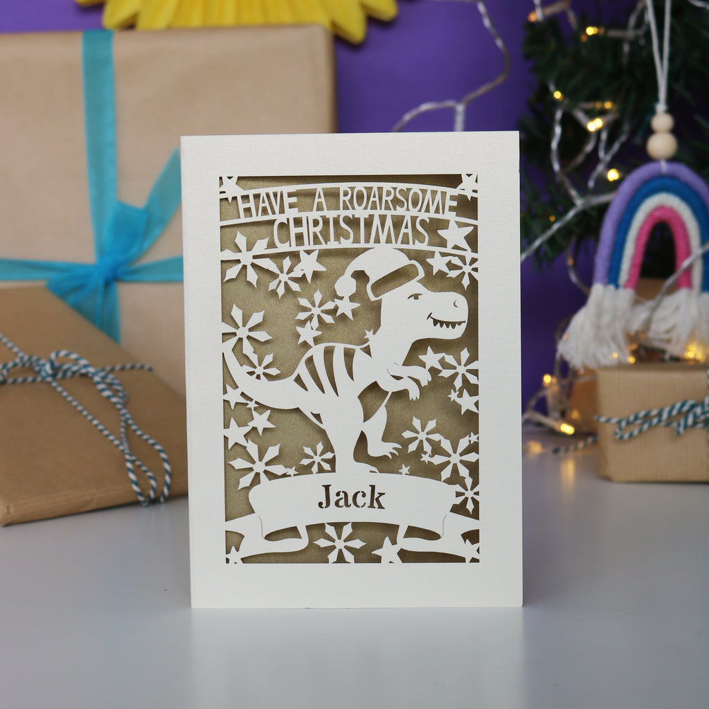 Laser cut Christmas card with dinosaur design