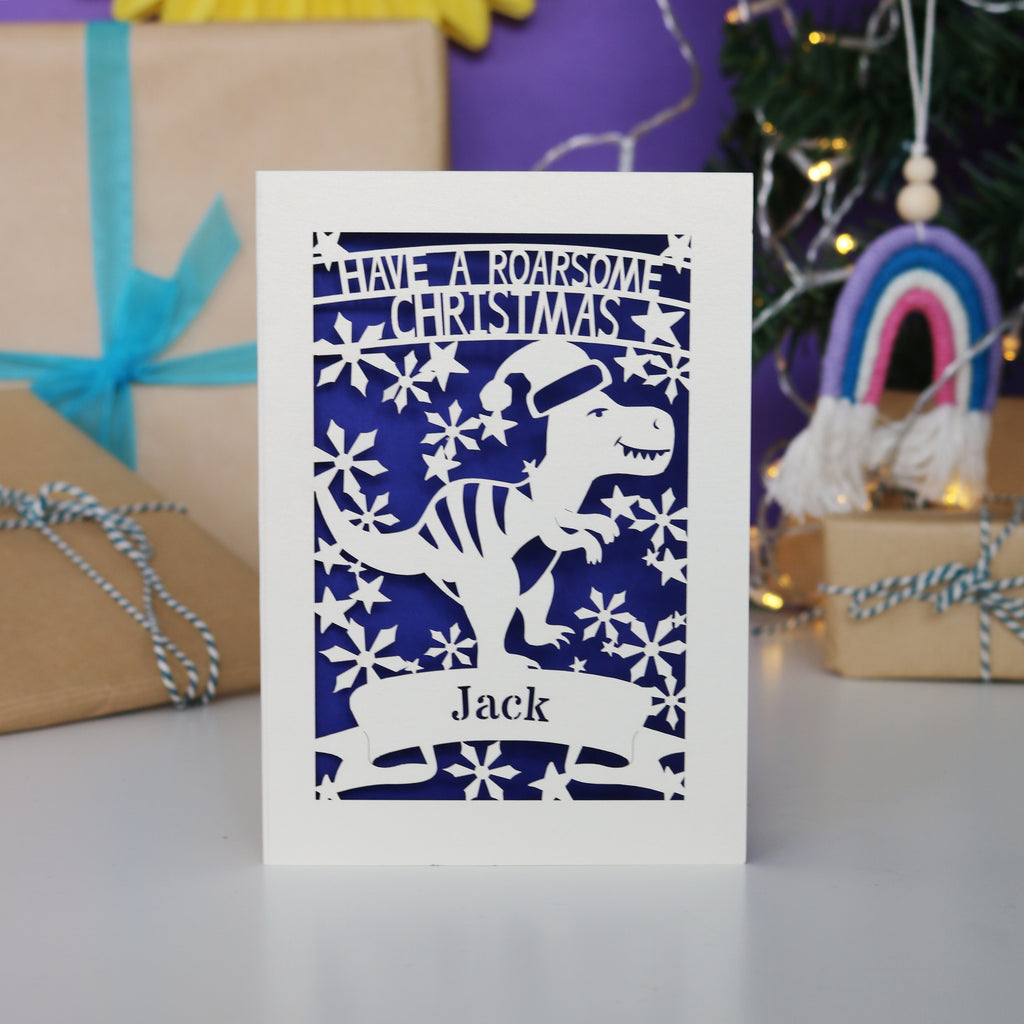 Laser cut Christmas card with dinosaur design