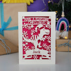 Laser cut Christmas card with dinosaur design