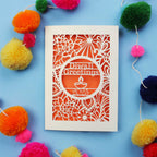 Laser Cut Diwali card with decorative elements on a blue background