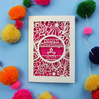 Diwali greeting card with decorative elements on a blue background