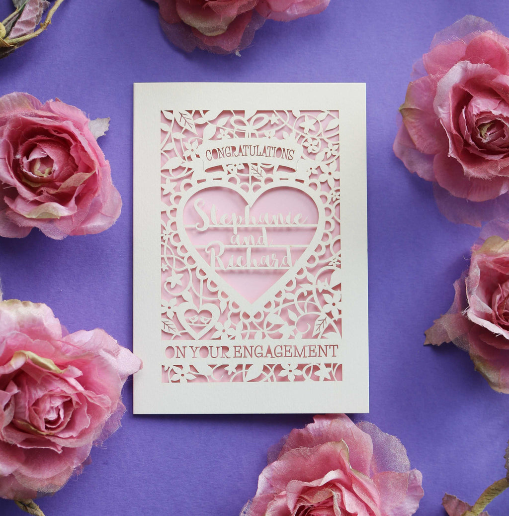 A cream and pink laser cut engagement card
