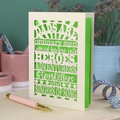 A laser cut father's Day card with cut out quote, "Dads are ordinary men turned by love into heroes, adventurers, storytellers and singers of song", with a cream card and bright green paper insert