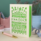 A laser cut father's Day card with cut out quote, "Dads are ordinary men turned by love into heroes, adventurers, storytellers and singers of song", with a cream card and bright green paper insert