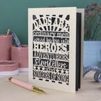 A laser cut father's Day card with cut out quote, "Dads are ordinary men turned by love into heroes, adventurers, storytellers and singers of song", with a cream card and grey paper insert