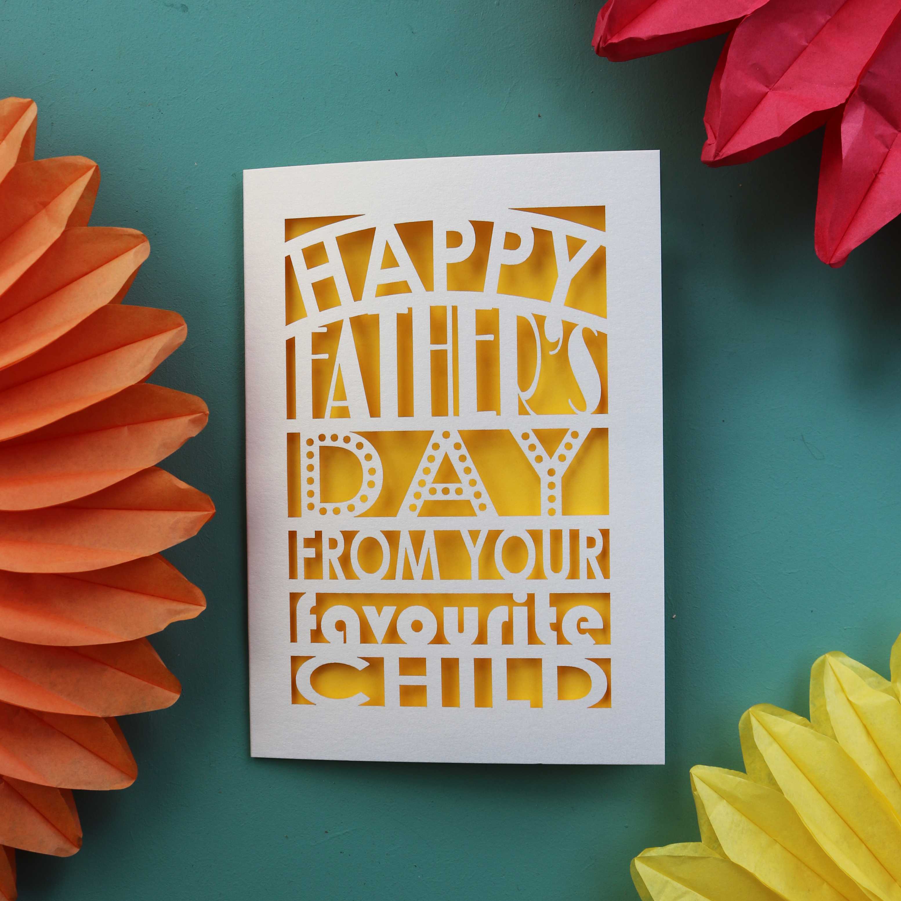 A laser cut fathers day card that says "Happy Father's Day from your favourite child"