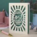 A laser cut first Father's Day card with "Happy first Father's Day" text in a sunbeam design