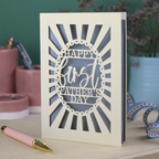 A laser cut first Father's Day card with "Happy first Father's Day" text in a sunbeam design