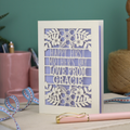 A floral laser cut 1st mother's day card with cut out text, "Happy First Mother's Day Love From" and is personalised with a name. 
