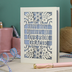 A floral laser cut 1st mother's day card with cut out text, "Happy First Mother's Day Love From" and is personalised with a name. 