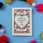 Decorative wedding anniversary card for Ruby and Jack's 1st anniversary with colourful pom-poms on a blue background