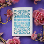 A laser cut First Mother's Day card with cut out text that says "Happy First Mother's Day, love from" and is personalised with a name
